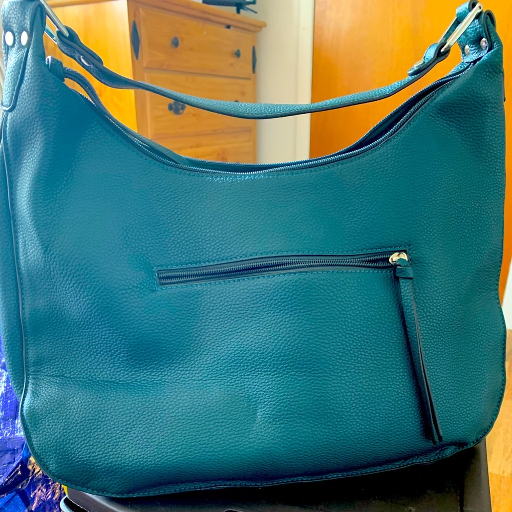 Regular Duffel bag..worn twice, with numerous space on the inside. Large